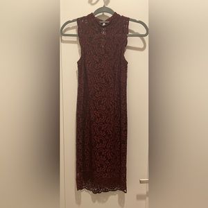 A deep maroon Miss Selfridge bodycon lace dress.